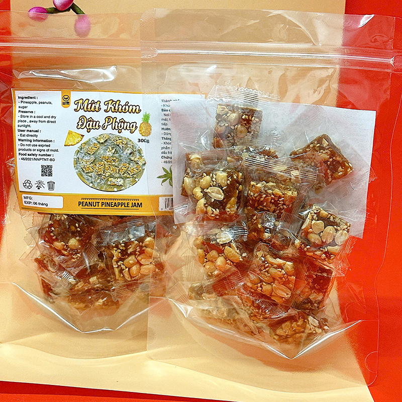 23380_z6125808216947-37f22420ae99fb385ed40ebb02067bd7_20241214103019-1.jpg Mứt Khóm Đậu Phộng Túi Zip 300g - MKDPTZ